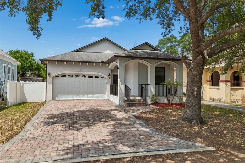 2311 West Aileen Street Tampa, FL 33607 - Photo 33 of 38 a front view of a house with a yard