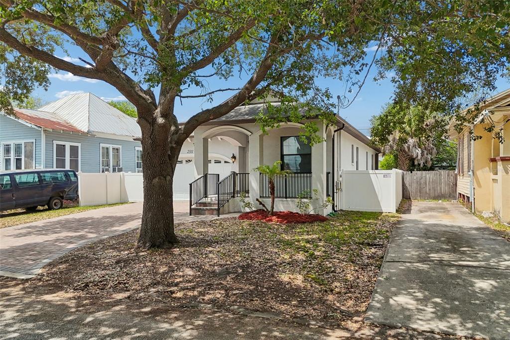 2311 West Aileen Street Tampa, FL 33607 - Photo 34 of 38 a front view of a house with a yard