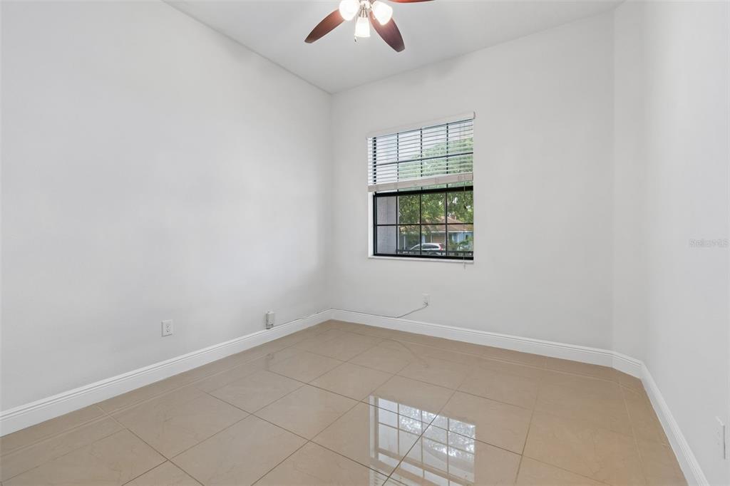 2311 West Aileen Street Tampa, FL 33607 - Photo 5 of 38 an empty room with a chandelier fan