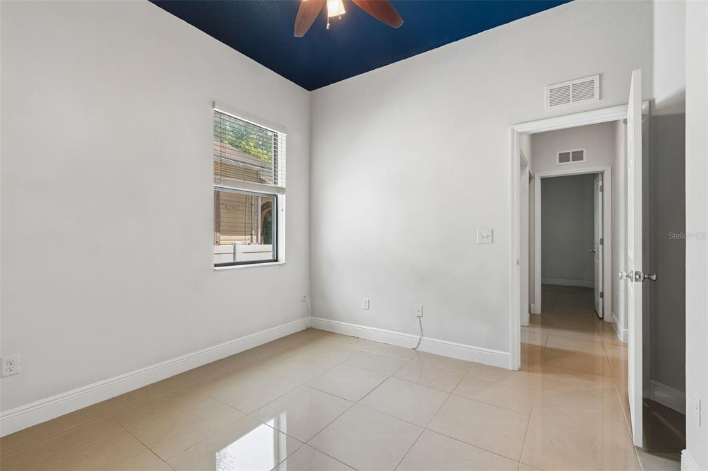 2311 West Aileen Street Tampa, FL 33607 - Photo 10 of 38 a view of empty room with window and chandelier fan