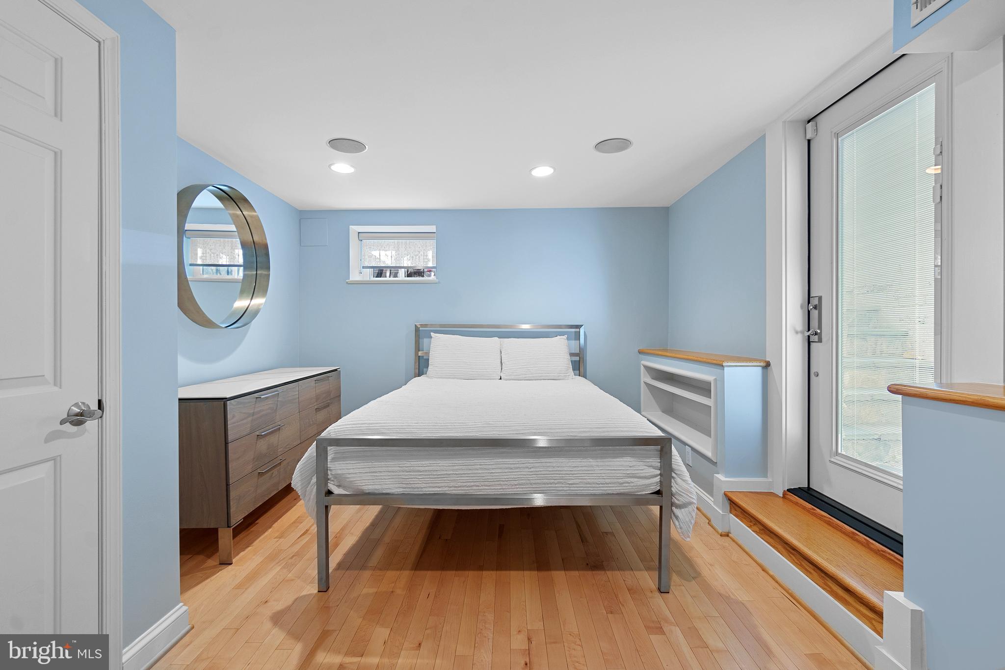 936 T Street Northwest, Unit B Washington, DC 20001 - Photo 14 of 19 a bedroom with a bed and a table in it