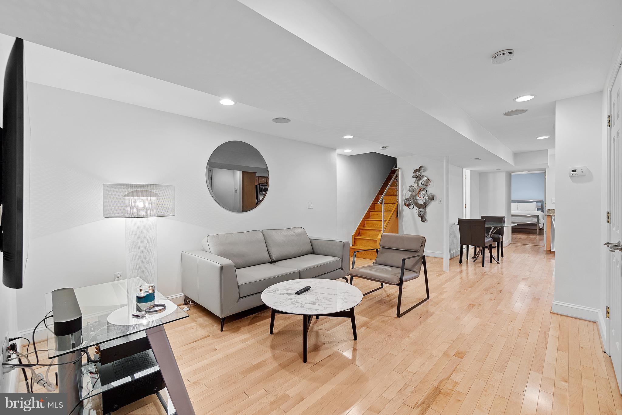 936 T Street Northwest, Unit B Washington, DC 20001 - Photo 3 of 19 a living room with furniture and a wooden floor