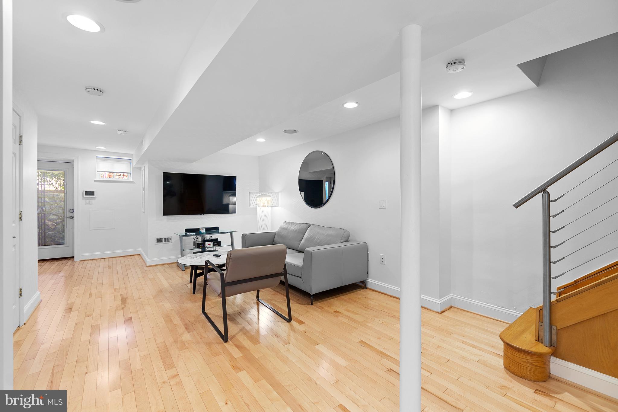936 T Street Northwest, Unit B Washington, DC 20001 - Photo 6 of 19 a living room with furniture and a flat screen tv