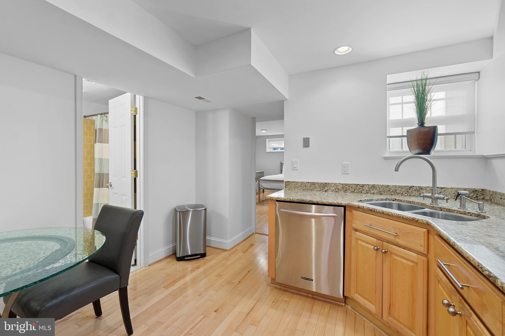 936 T Street Northwest, Unit B Washington, DC 20001 - Photo 7 of 19 a kitchen with sink cabinets and dining table