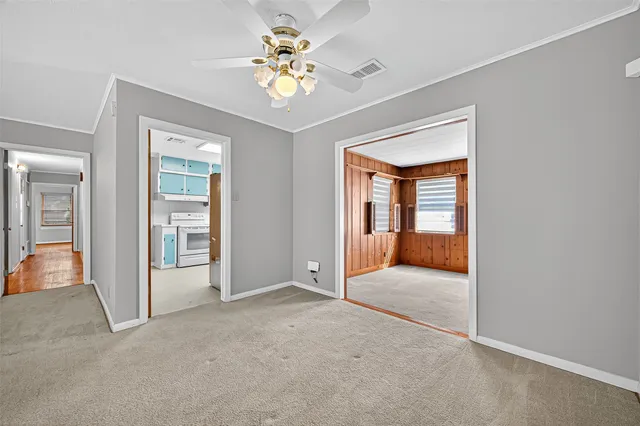 a view of a hallway with a chandelier