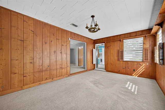 a kitchen with a stove sink and cabinets