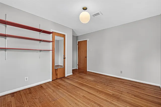 a bathroom with a toilet a sink and a mirror