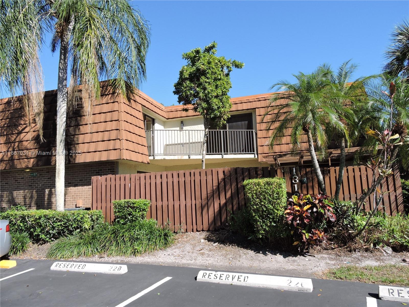 1316 Southwest 118th Terrace, Unit 1316 Davie, FL 33325 - Photo 2 of 44 a house view with a garden space