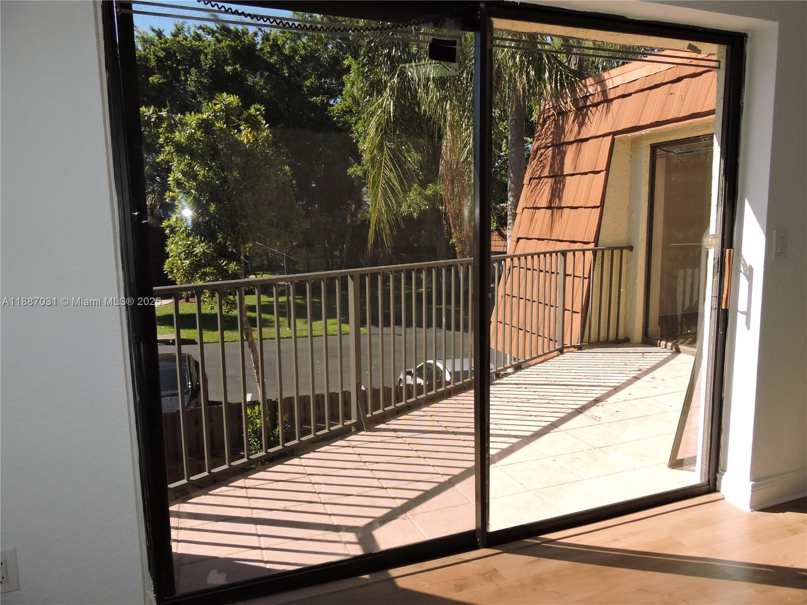 1316 Southwest 118th Terrace, Unit 1316 Davie, FL 33325 - Photo 26 of 44 a view of a balcony with a swing