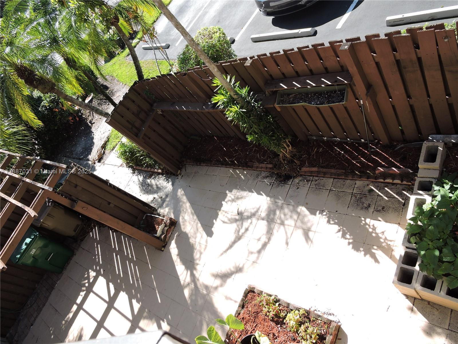1316 Southwest 118th Terrace, Unit 1316 Davie, FL 33325 - Photo 27 of 44 a view of balcony with a potted plant