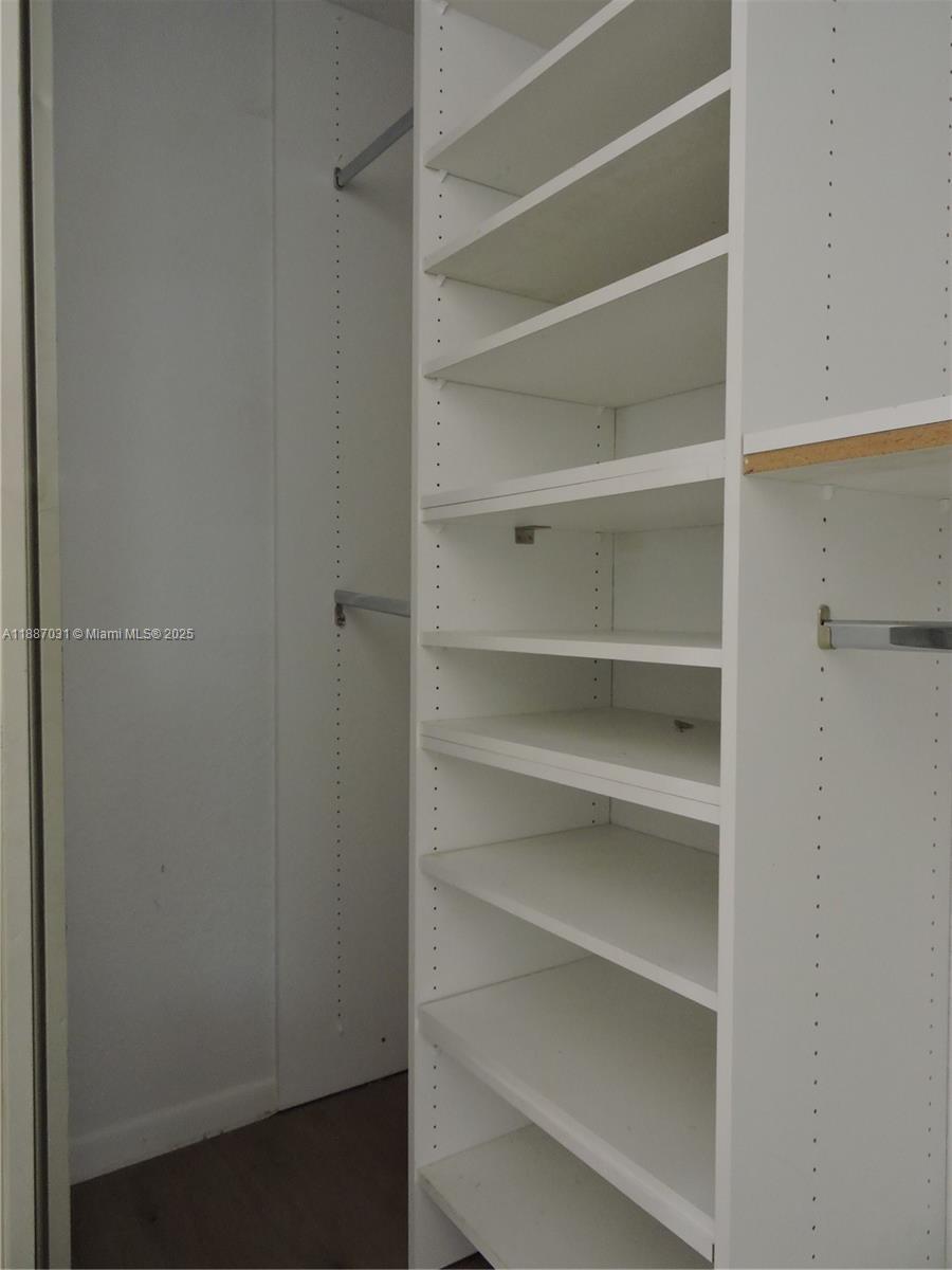 1316 Southwest 118th Terrace, Unit 1316 Davie, FL 33325 - Photo 29 of 44 a view of walk in closet with empty racks