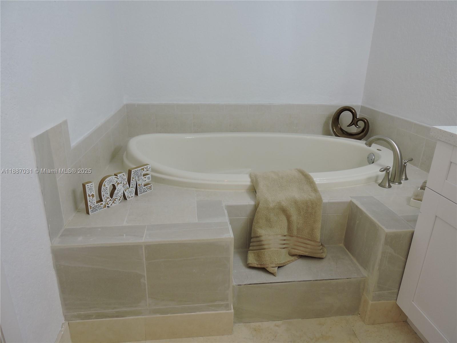 1316 Southwest 118th Terrace, Unit 1316 Davie, FL 33325 - Photo 33 of 44 a bathroom with a bathtub