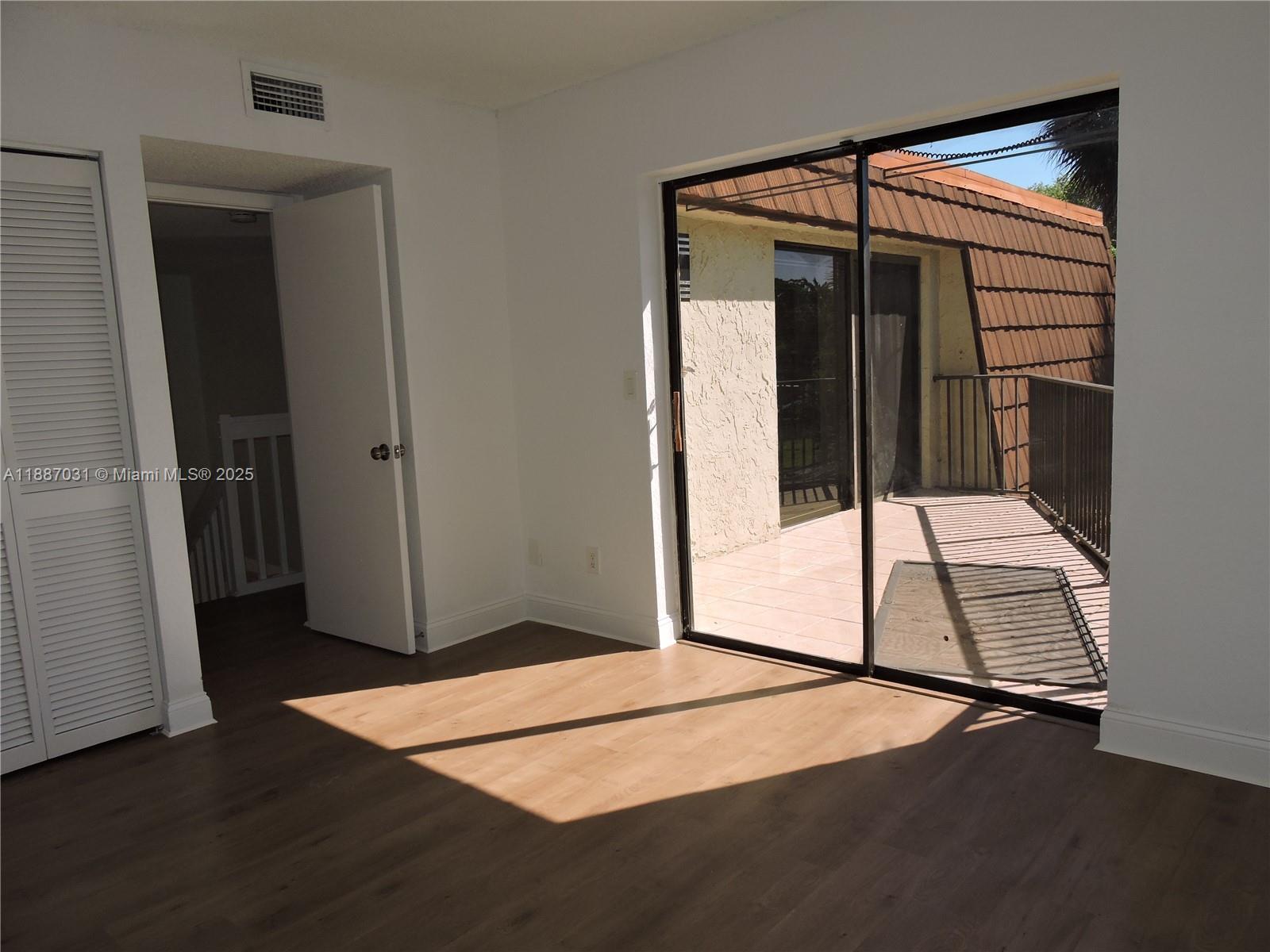 1316 Southwest 118th Terrace, Unit 1316 Davie, FL 33325 - Photo 39 of 44 an entryway of a house with wooden floor