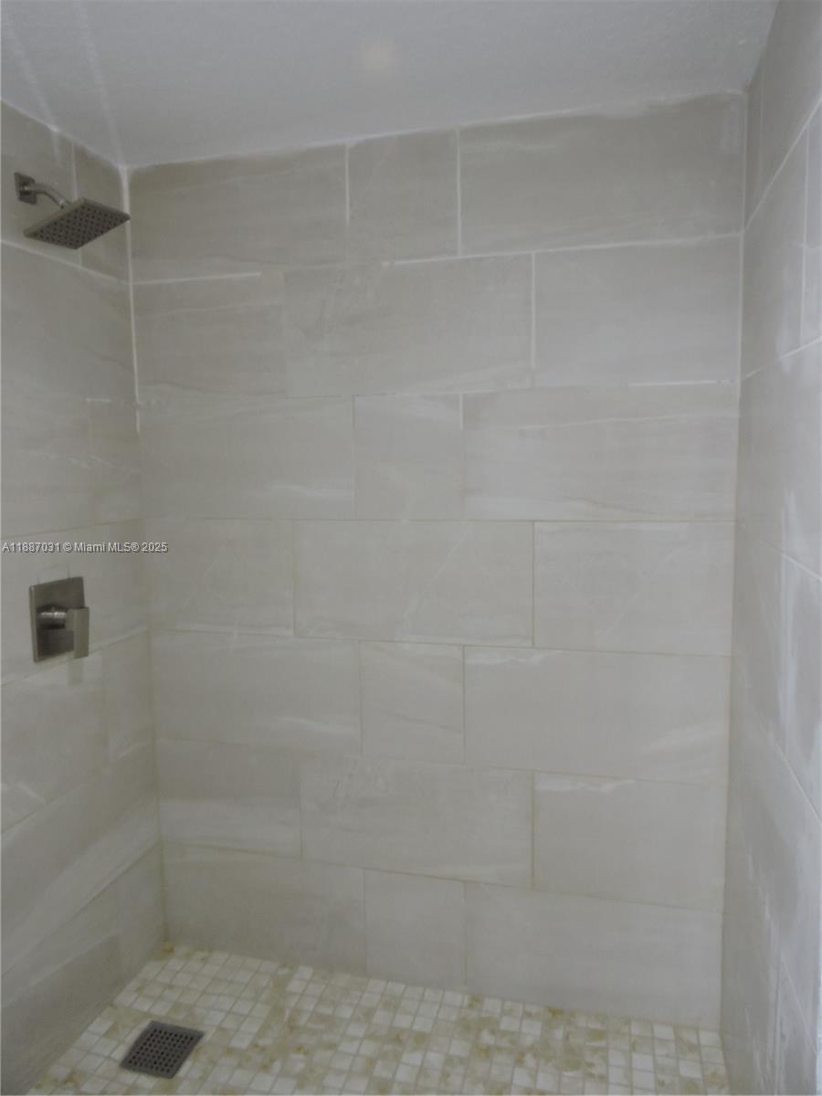 1316 Southwest 118th Terrace, Unit 1316 Davie, FL 33325 - Photo 42 of 44 a bathroom with a shower