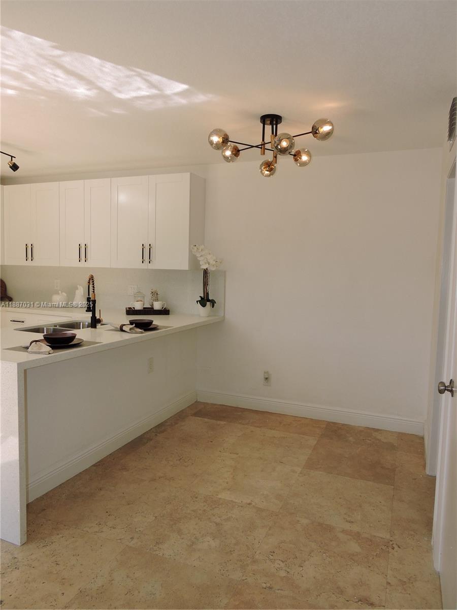 1316 Southwest 118th Terrace, Unit 1316 Davie, FL 33325 - Photo 10 of 44 a view of a room with rack and equipment