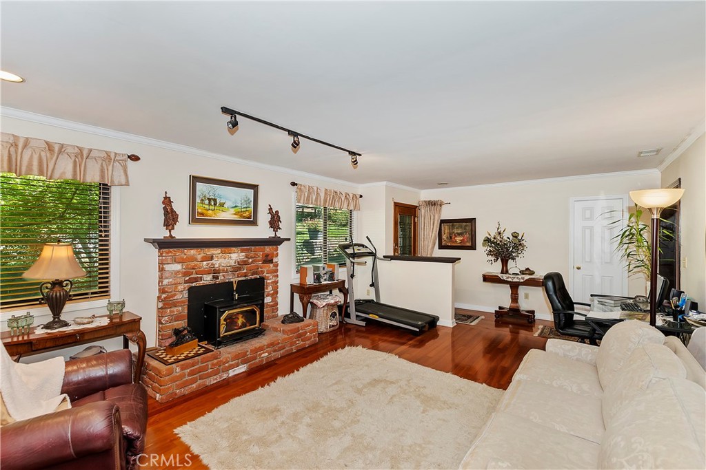 23167 Brookside Road Crestline, CA 92325 - Photo 18 of 49 a living room with furniture and a fireplace