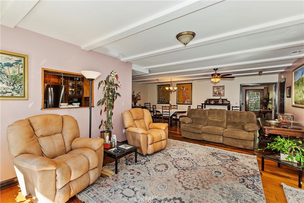 23167 Brookside Road Crestline, CA 92325 - Photo 19 of 49 a living room with furniture ceiling fan and a rug