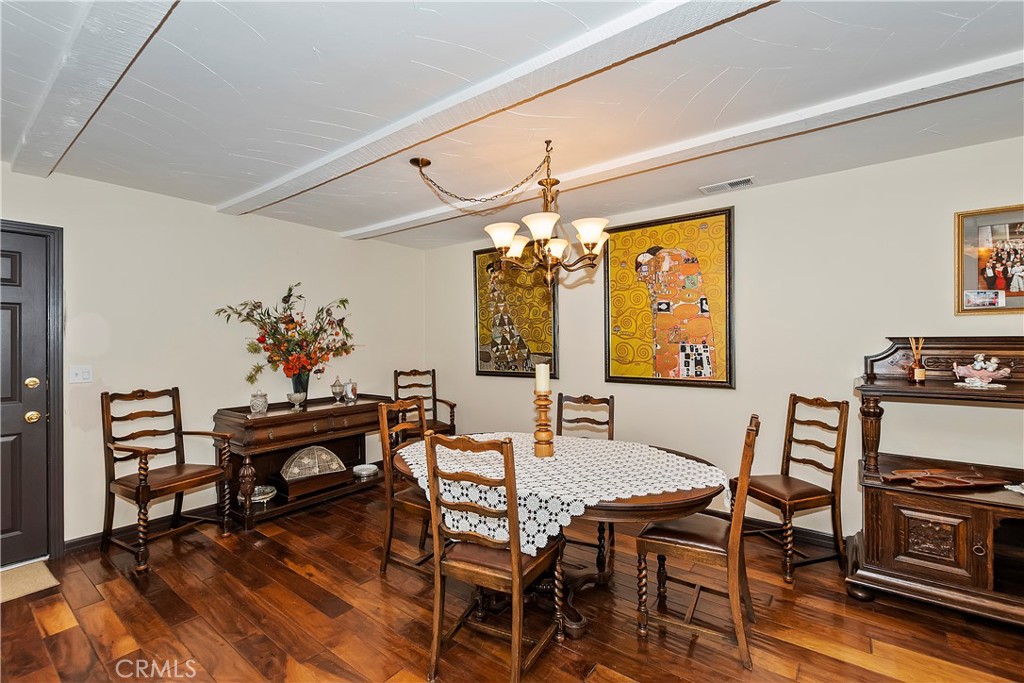 23167 Brookside Road Crestline, CA 92325 - Photo 20 of 49 a view of a dining room with furniture window and wooden floor