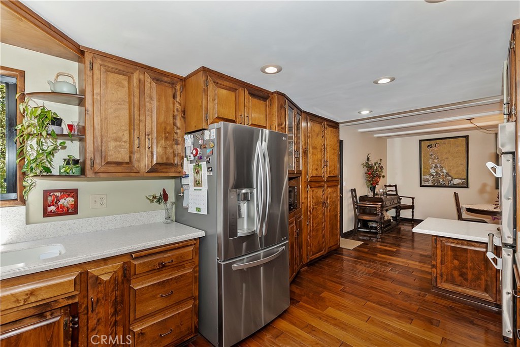 23167 Brookside Road Crestline, CA 92325 - Photo 22 of 49 a kitchen with stainless steel appliances granite countertop a refrigerator and a stove top oven