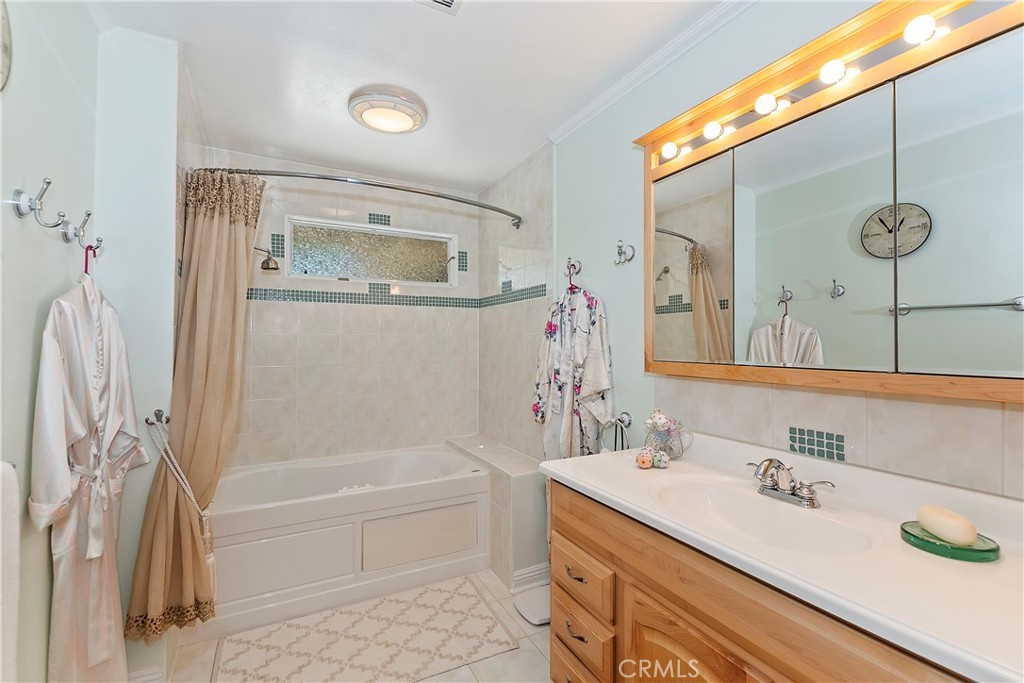 23167 Brookside Road Crestline, CA 92325 - Photo 25 of 49 a bathroom with a tub sink and mirror