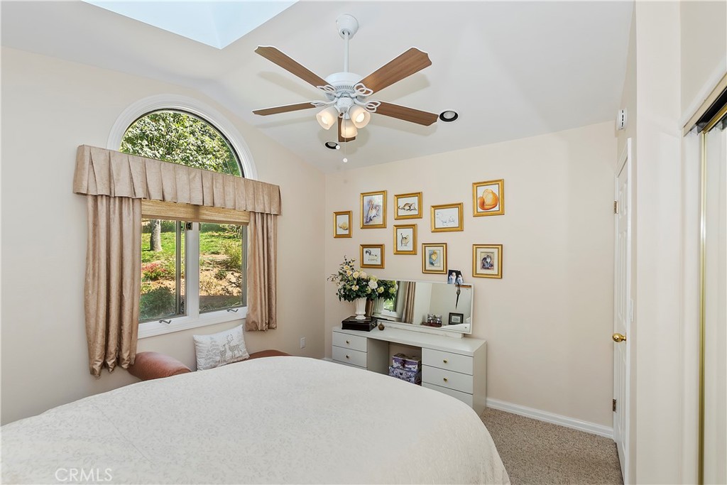 23167 Brookside Road Crestline, CA 92325 - Photo 26 of 49 a bedroom with a bed and a window