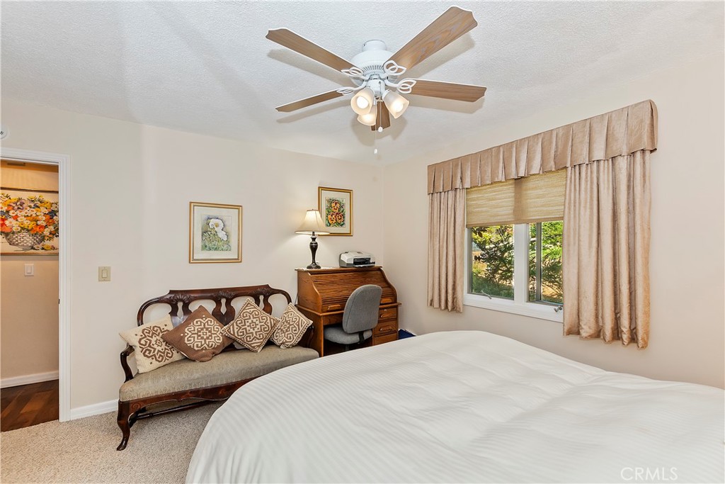 23167 Brookside Road Crestline, CA 92325 - Photo 27 of 49 a bedroom with a large bed and a window