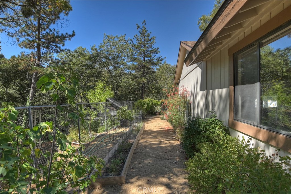 23167 Brookside Road Crestline, CA 92325 - Photo 40 of 49 a backyard of a house with a yard and outdoor seating