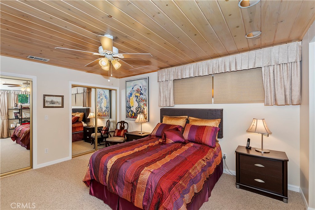 23167 Brookside Road Crestline, CA 92325 - Photo 9 of 49 a bedroom with a bed and window
