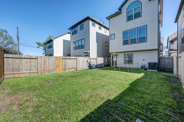 a bedroom with a bed and chair