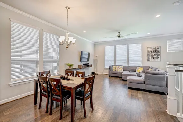 a view of a dining room with furniture window and wooden floor