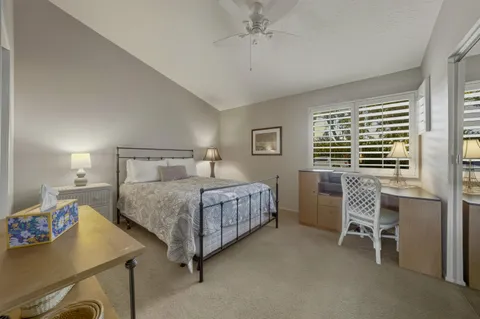 a bedroom with a bed and a table in it