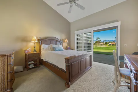 a bedroom with a bed and a table