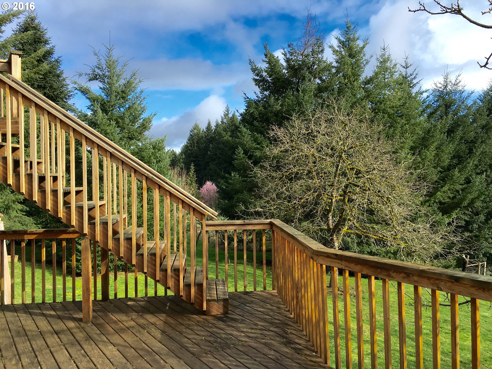17640 Southwest Neugebauer Road Hillsboro, OR 97123 - Photo 26 of 30 a balcony with wooden floor and fence