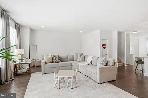 a living room with furniture and a table