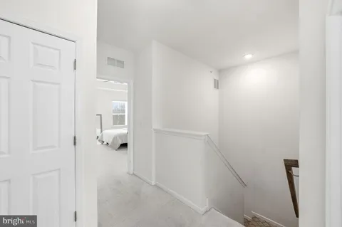 a room with toys and a view of living room