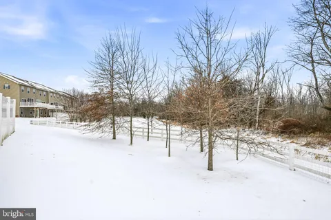 a front view of a residential apartment building with a yard
