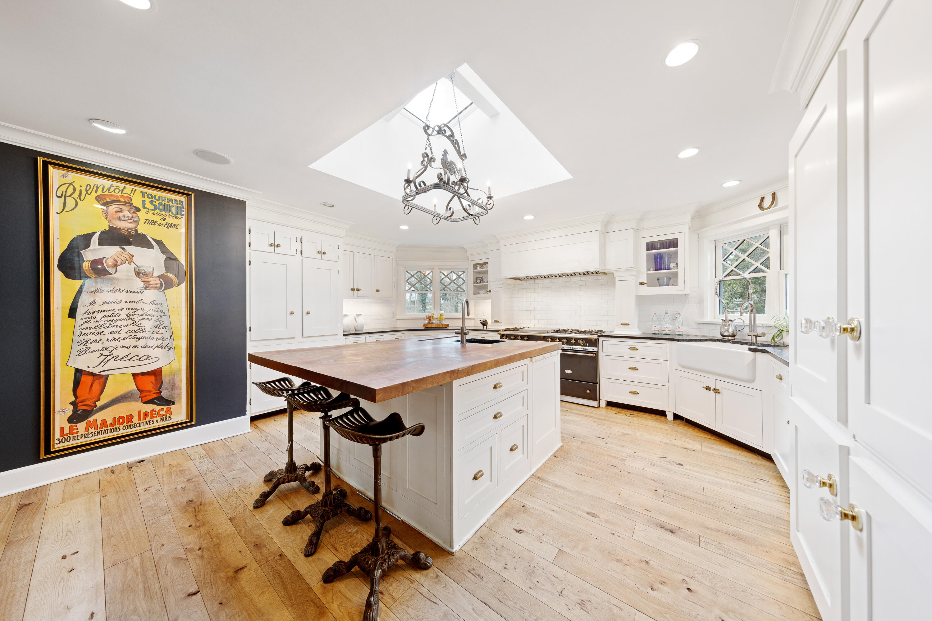 121 Middlesex Road Darien, CT 06820 - Photo 12 of 34 a kitchen with stainless steel appliances granite countertop a sink cabinets and wooden floor