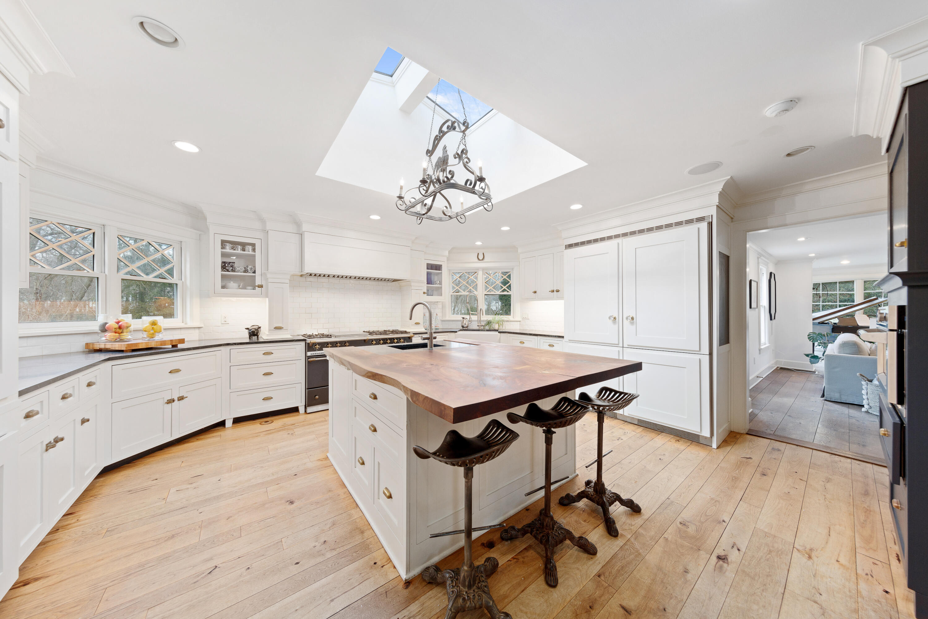 121 Middlesex Road Darien, CT 06820 - Photo 13 of 34 a kitchen with a stove a refrigerator and a sink with wooden floor