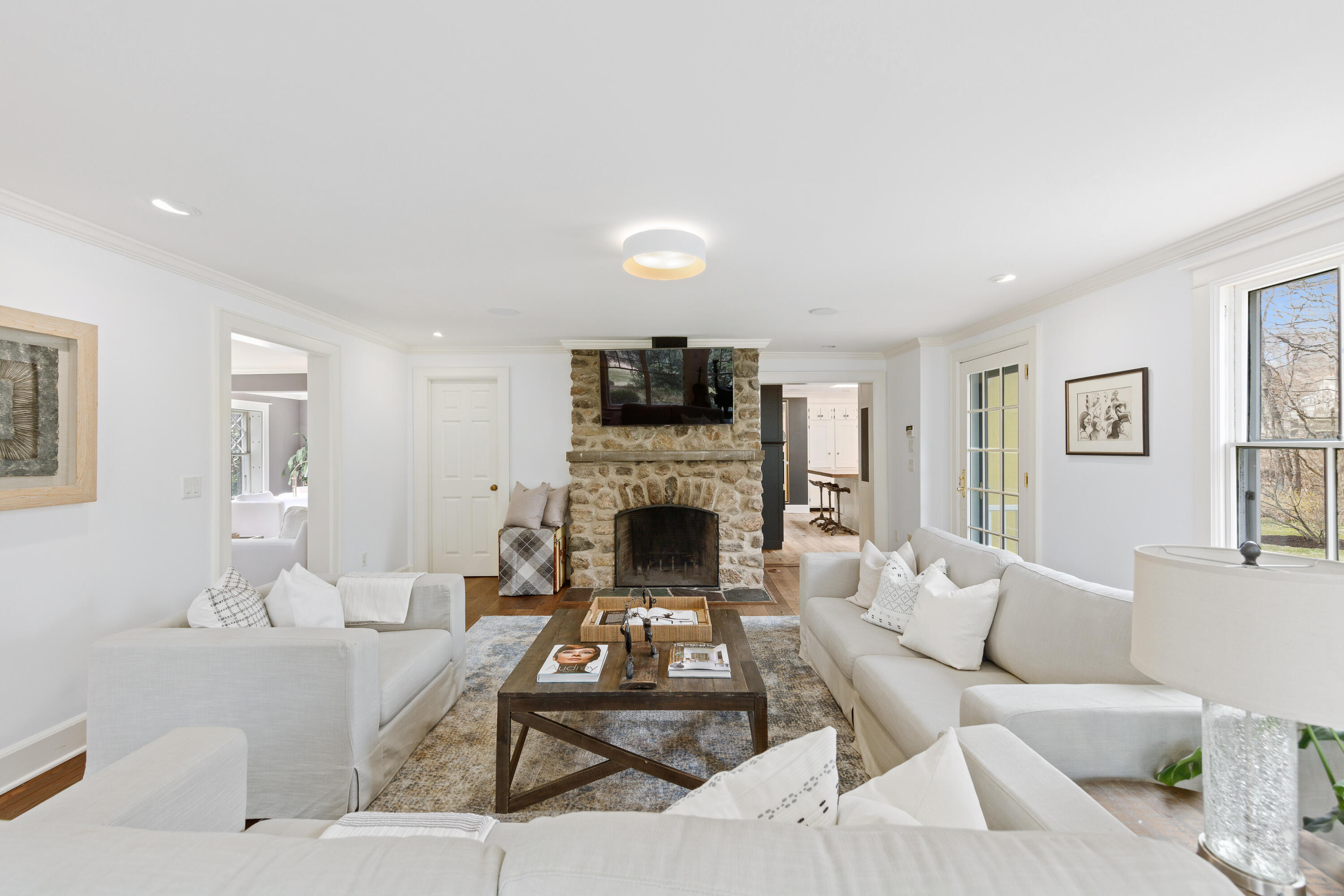 121 Middlesex Road Darien, CT 06820 - Photo 18 of 34 a living room with furniture a fireplace and a flat screen tv