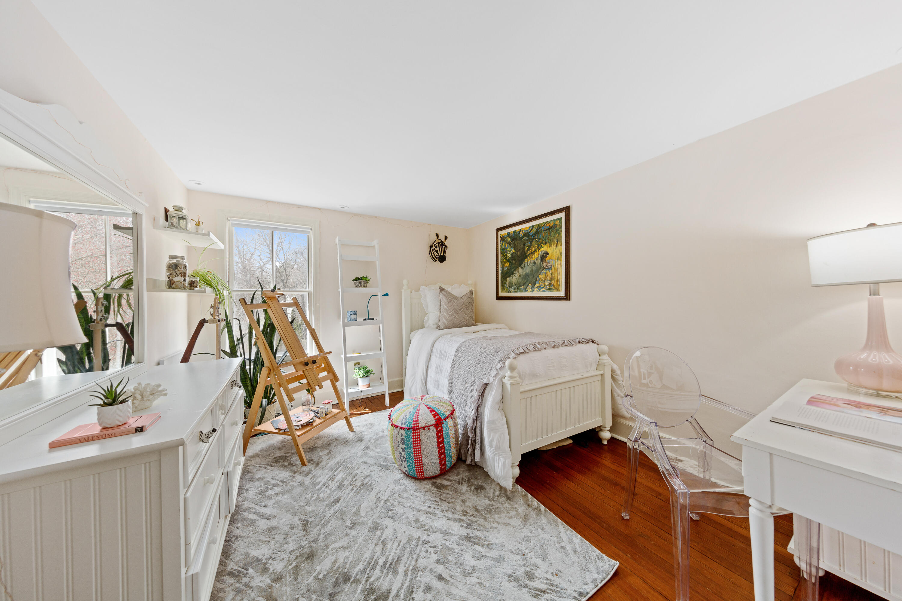 121 Middlesex Road Darien, CT 06820 - Photo 24 of 34 a bedroom with a bed and a table