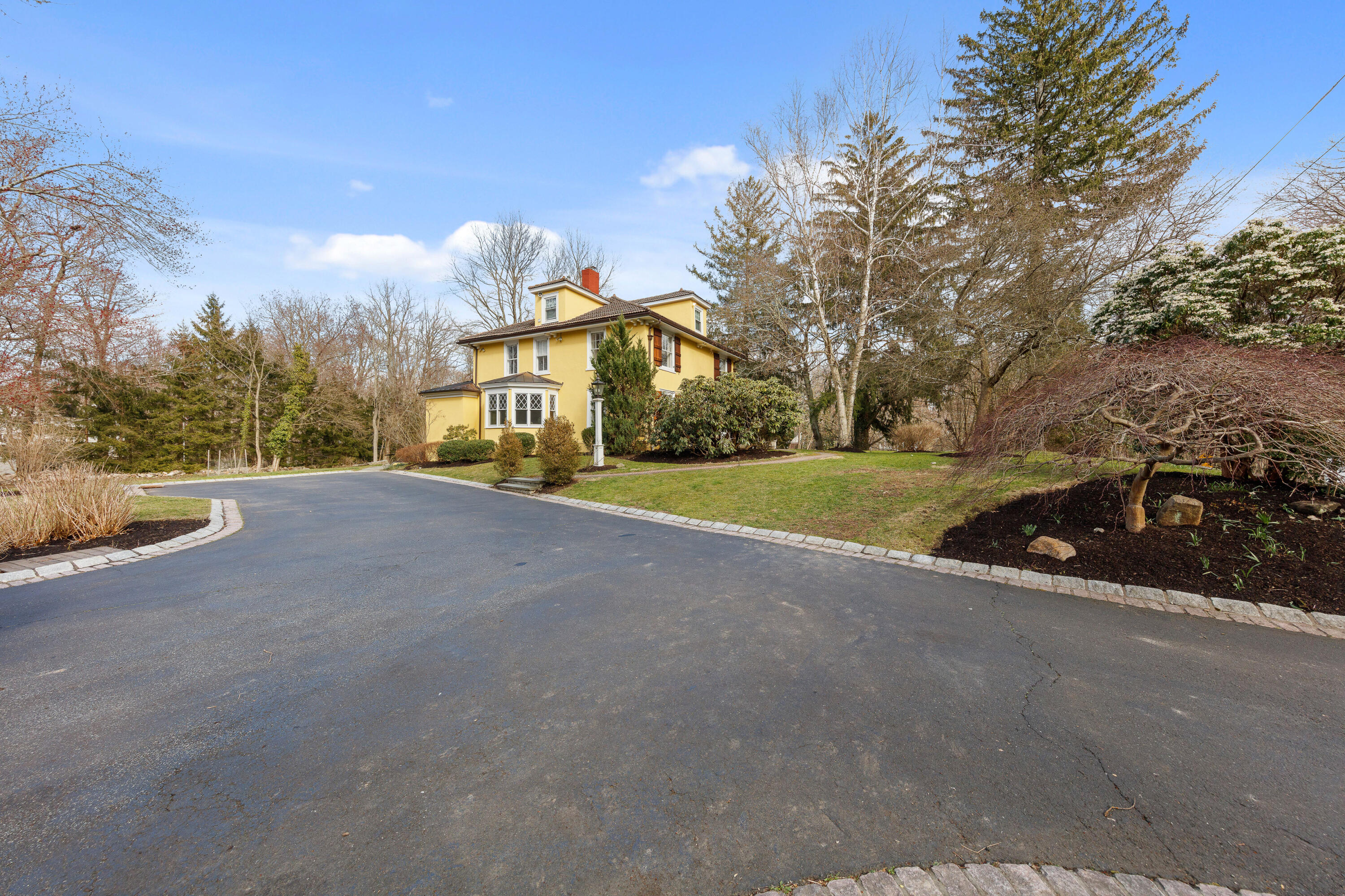 121 Middlesex Road Darien, CT 06820 - Photo 27 of 34 a view of a road with a building in the background