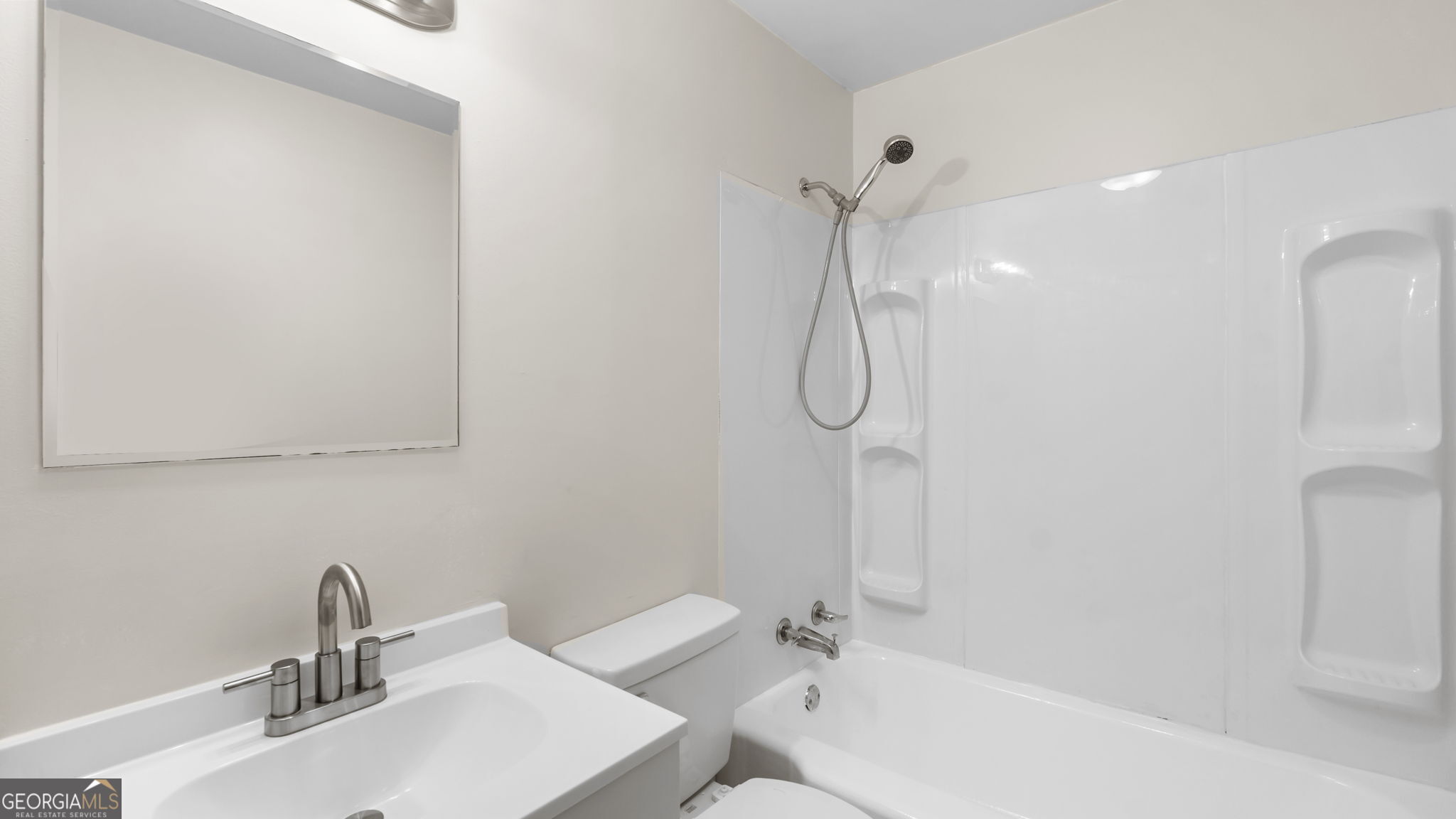335 South McLin Street Rome, GA 30161 - Photo 11 of 21 a bathroom with a sink a toilet and shower