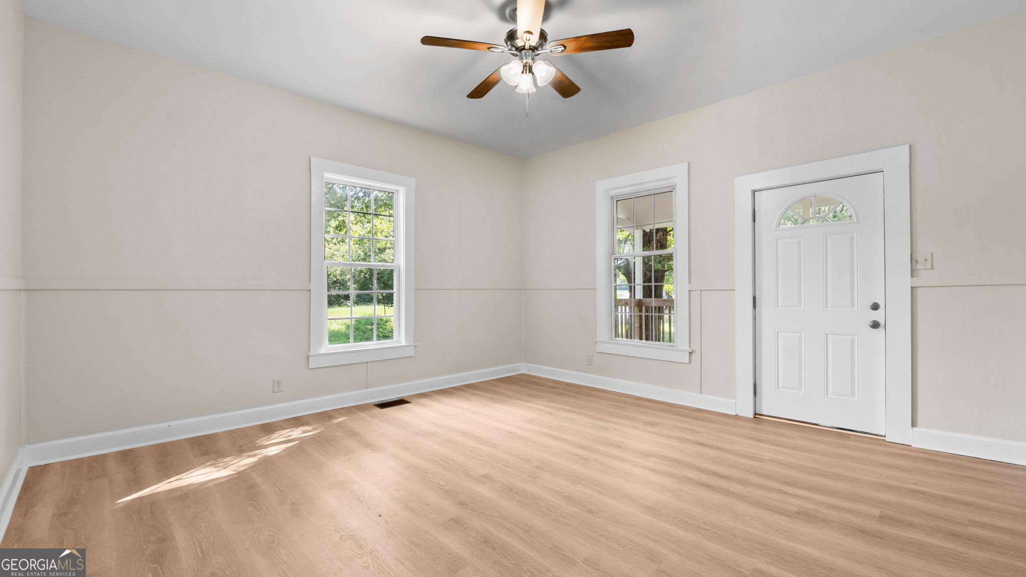 335 South McLin Street Rome, GA 30161 - Photo 4 of 21 a view of empty room with wooden floor and fan