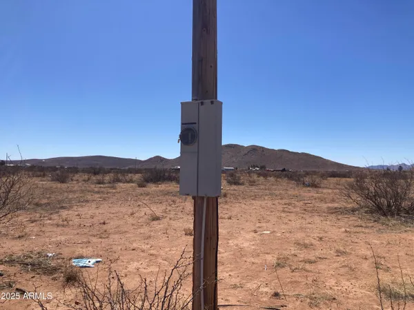a view of a road with mountain in the background