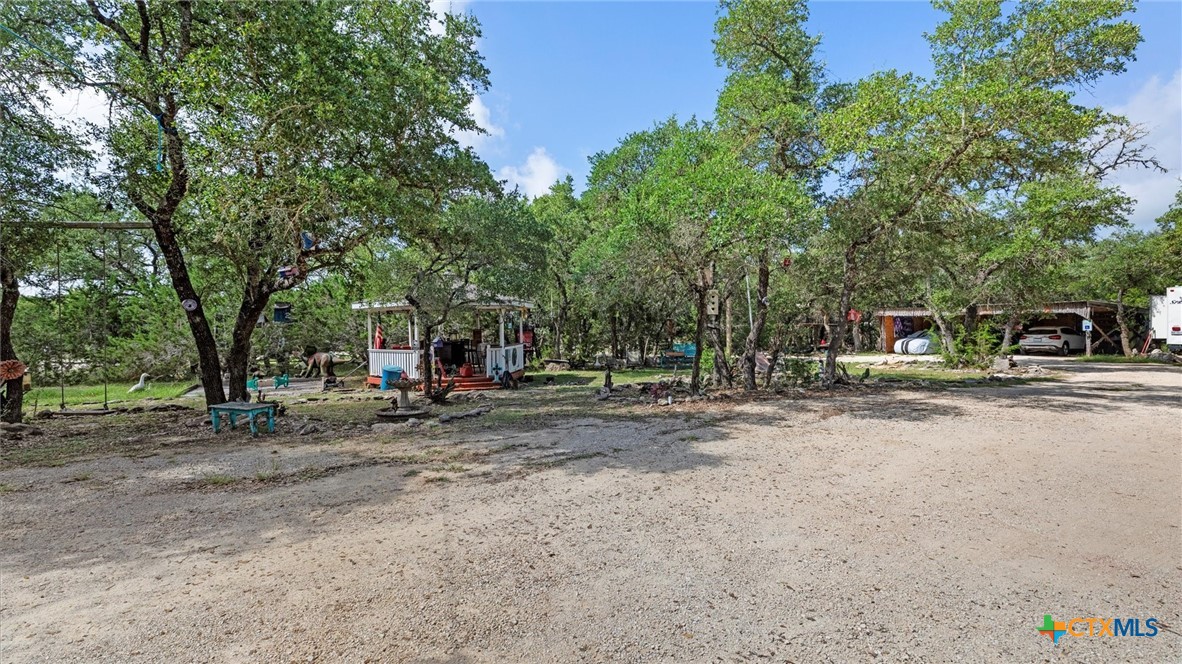 857 Derrick Drive Spring Branch, TX 78070 - Photo 1 of 32 a view of street with trees