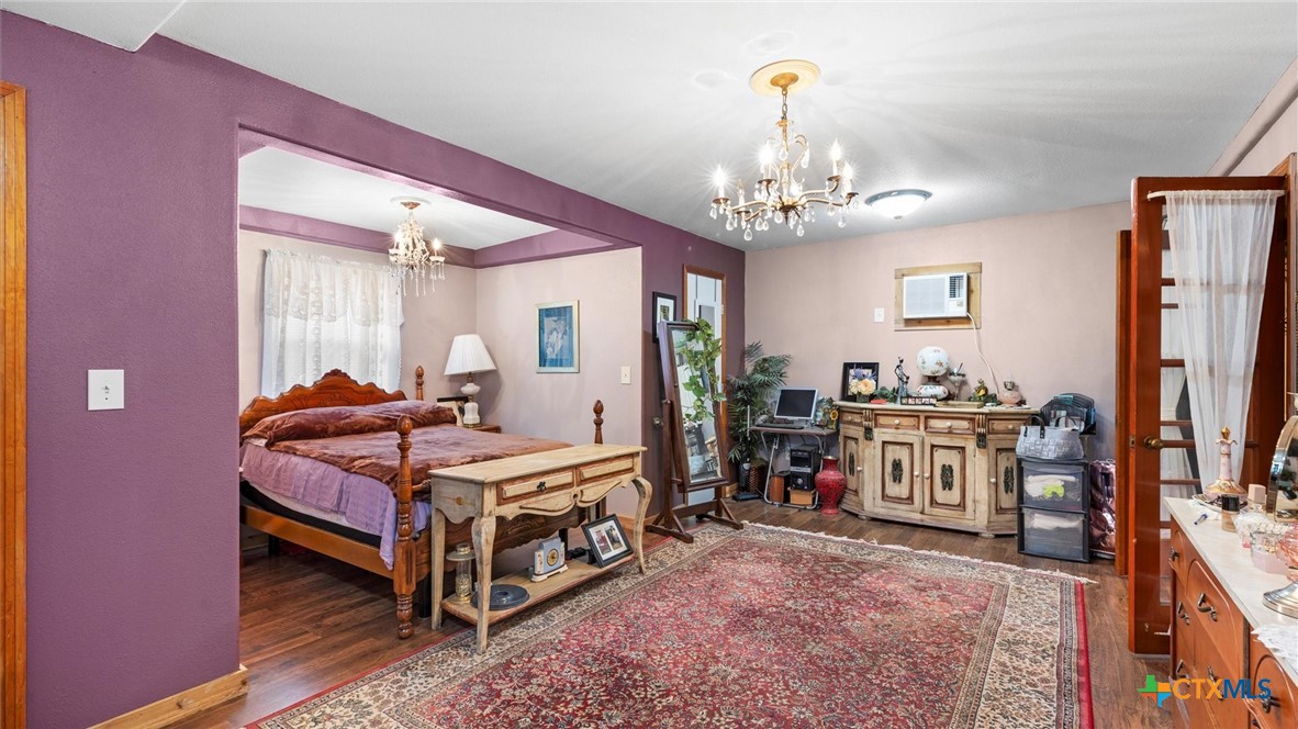 857 Derrick Drive Spring Branch, TX 78070 - Photo 11 of 32 a bedroom with a bed dresser and a flat screen tv