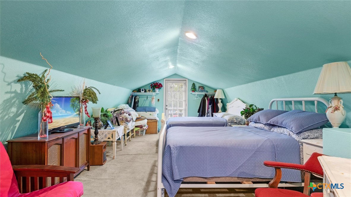 857 Derrick Drive Spring Branch, TX 78070 - Photo 15 of 32 a bedroom with furniture and a baby crib