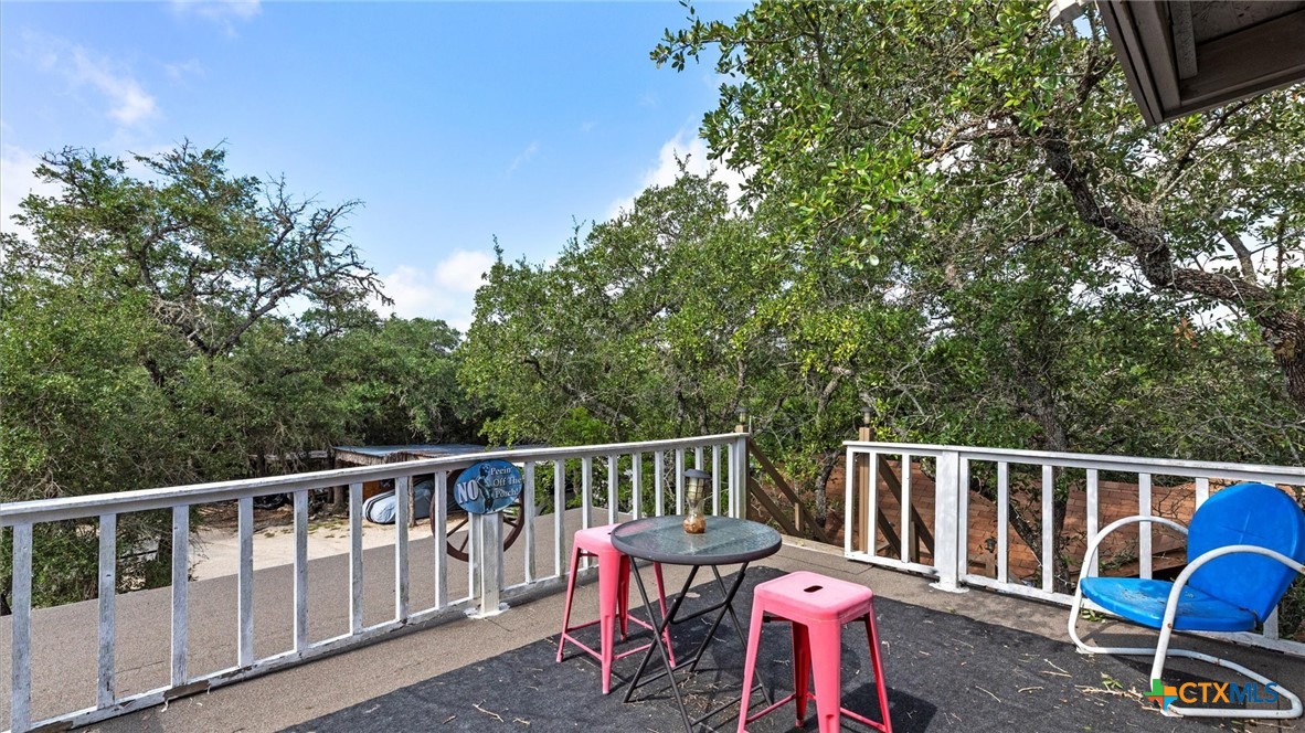 857 Derrick Drive Spring Branch, TX 78070 - Photo 16 of 32 a view of a chair and table on the wooden floor