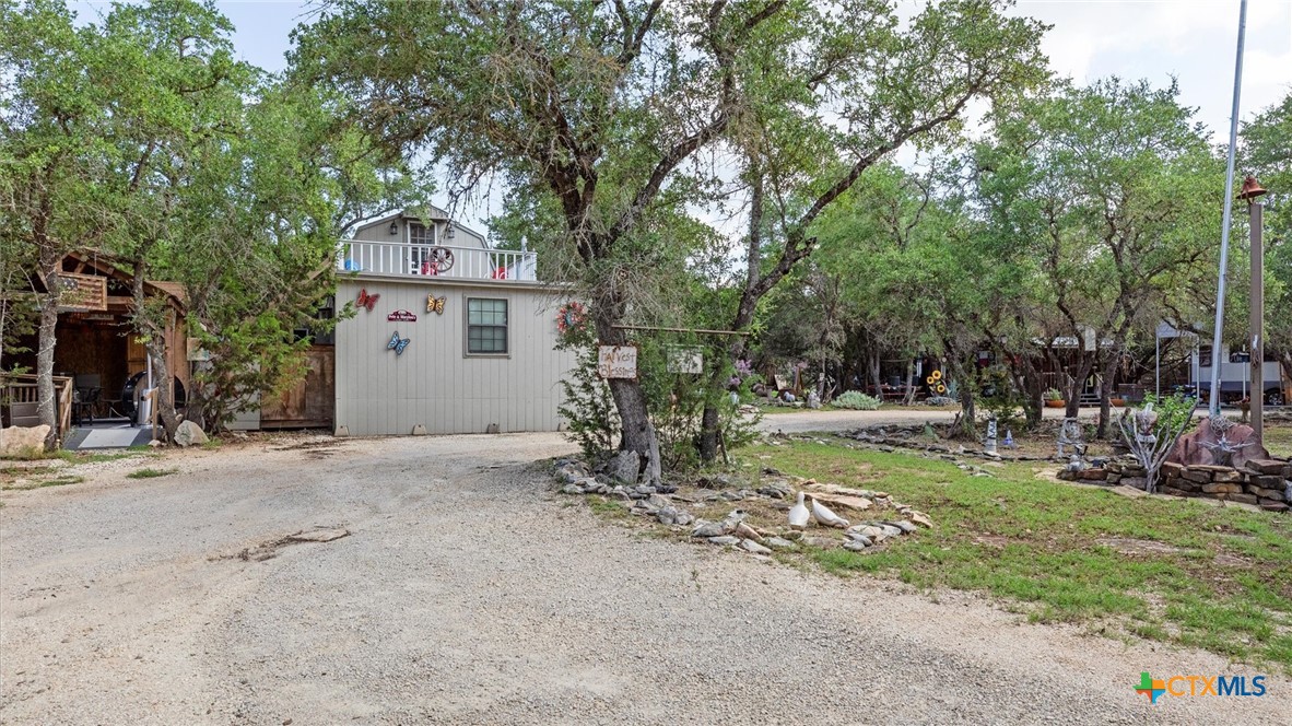 857 Derrick Drive Spring Branch, TX 78070 - Photo 21 of 32 a front view of a house with garden