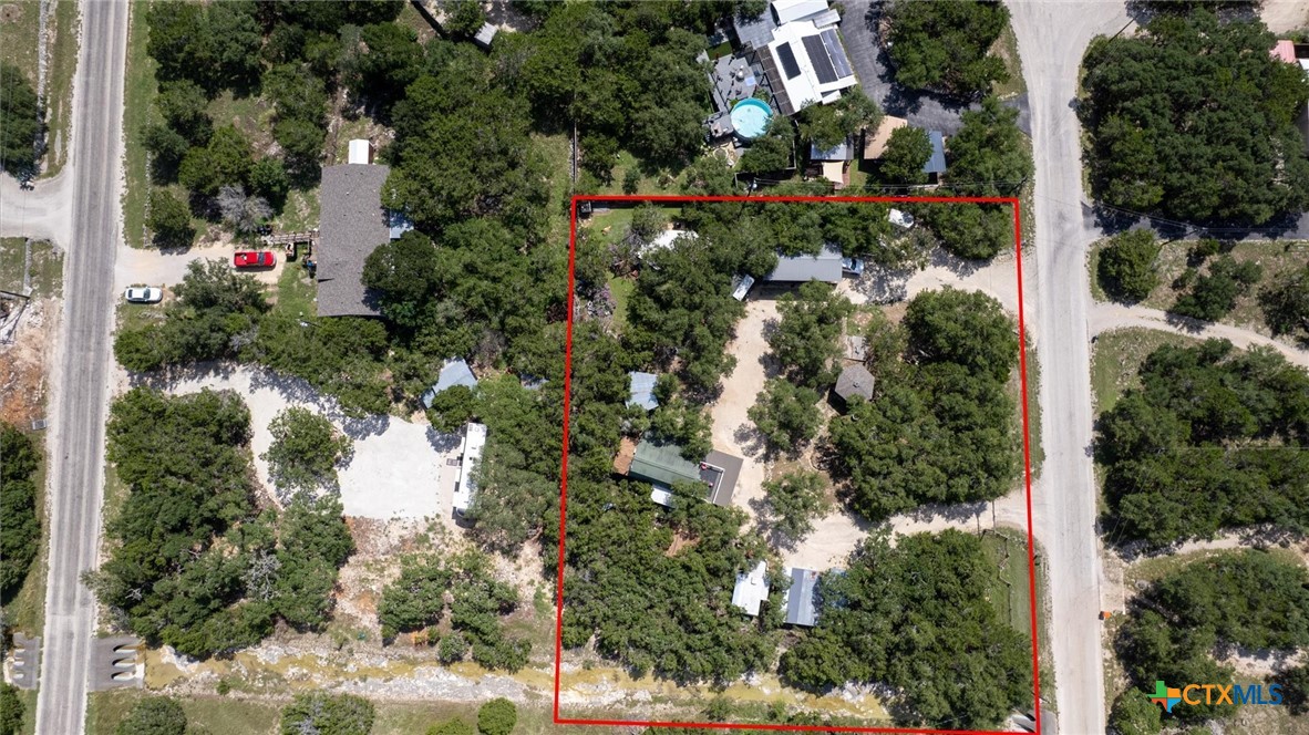 857 Derrick Drive Spring Branch, TX 78070 - Photo 3 of 32 an aerial view of residential houses with outdoor space and trees